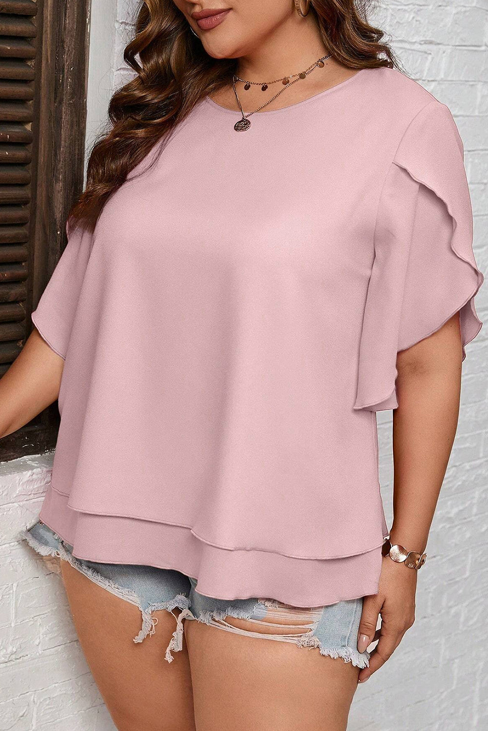 Blusa de media manga con cuello redondo y talla grande